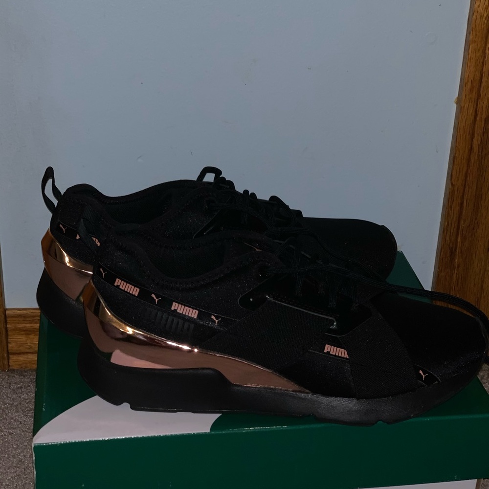 Rose gold and black pumas